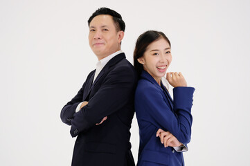 Young businesswoman and young businessman smiling on a white background.