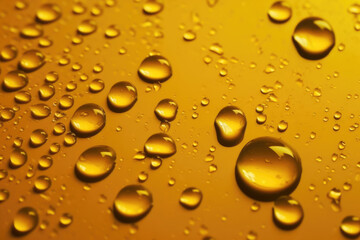 Fototapeta na wymiar Water drops on a yellow background.