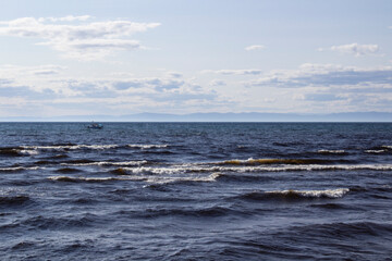 Lake Baikal shore with fresh water waves