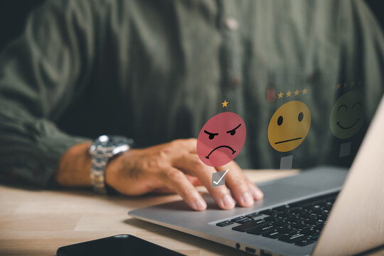 Concept of negative review and customer dissatisfaction. Choosing 1-star rating in survey, signifying bad user experience via smartphone. customer satisfaction and discontentment in online evaluations