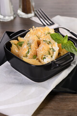 Pasta conchiglie stuffed with spinach, ricotta and parmesan baked