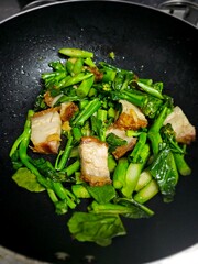 Stir fry Kai Land and crispy pork