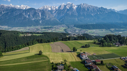 Alps. Landscape drone view. Road and fields. 