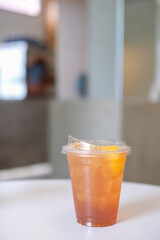 A cup of peach tea on the table