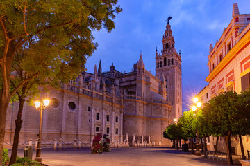 Famous Bell Tower named Giralda and Cathedral Saint Mary of the See at night, Seville, Andalusia, Spain