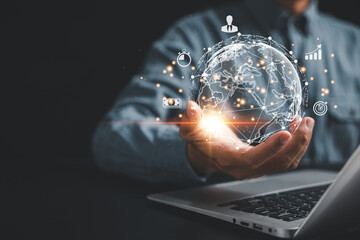 Data-driven research and global business. Man's hand holding virtual Global Internet connection in the metaverse with laptop. Technology, digital marketing, and financial solutions.