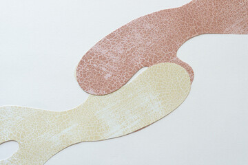 two paper shapes interacting on blank paper