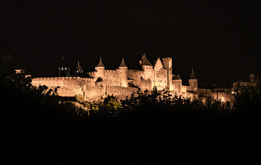 Spectacular Illuminated Ancient Fortress Of Medieval City Carcassonne In The Night In Occitania,...