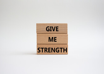 Give me strength symbol. Concept word Give me strength on wooden blocks. Beautiful white background. Business and Give me strength concept. Copy space