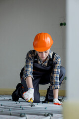 Worker is installing underfloor heating system. Warm floor heating system