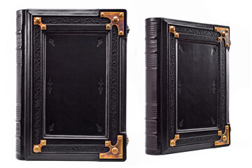 Black leather book with metal corners captured isolated