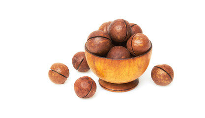 Macadamia nuts in bowl on a white