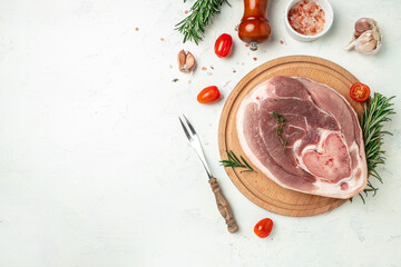 Slices of raw pork knuckle on a light background, Culinary cooking. banner, menu, recipe place for text, top view