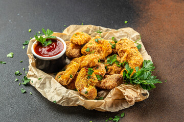 Crispy oven baked chicken nuggets and ketchup. Restaurant menu, dieting, cookbook recipe top view