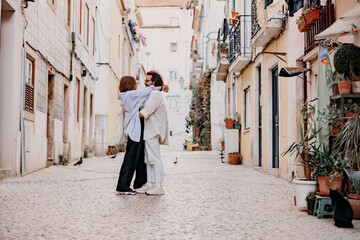 Tourist couple cuddling on old Lisbon street. Travel And tourism In Europe concept
