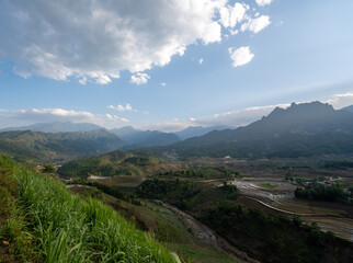 Fototapeta na wymiar The pouring water season makes the terraced fields of Y Ty commune, Lao Cai province, Vietnam appear with brown soil blending with the beautiful sky.