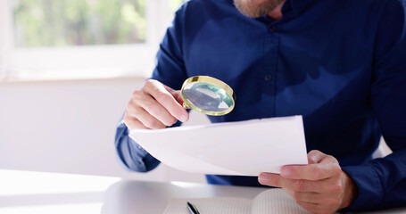 Businessman Investigation Finance Using Magnifying Glass