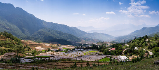 The pouring water season makes the terraced fields of Y Ty commune, Lao Cai province, Vietnam appear with brown soil blending with the beautiful sky.