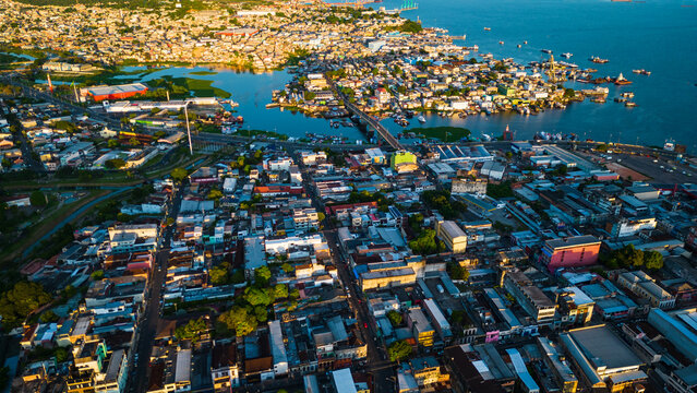 Manaus, Brazil. Aerial drone flight above city at sunset. © Michele