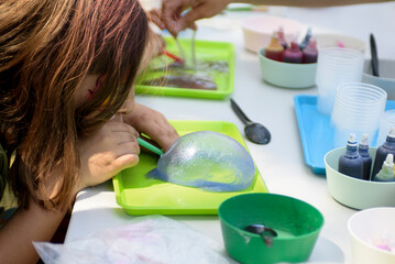 Making a slime for hands for a children's holiday. Chemical experiments.