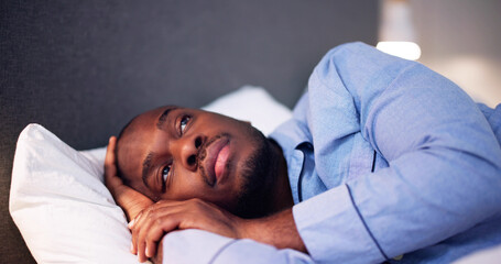 Young African Man Suffering From Fever Lying