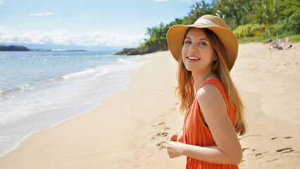 Panoramic photo of smiling girl in straw hat and sundress turning without looking into the camera...