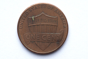 the reverse of an uncirculated 2014 US one cent coin with minor scuffs and scratches, close-up on a...