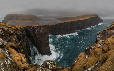 Lake above the sea and high cliffs - Sørvágsvatn lake and cliffs above Atlantic Ocean in Faroe Islands, Slave Cliff