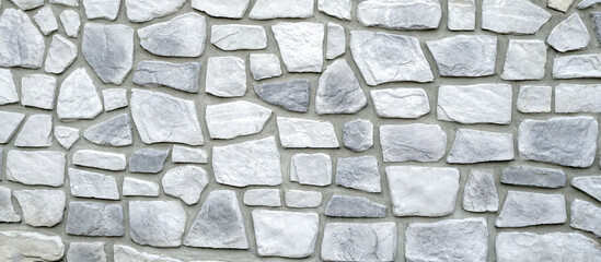 Stones Wall Texture, Abstract background. Grey granite wall background. Stacked rough cut stone wall texture background.
