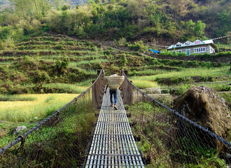 porter walking on the suspension bridge