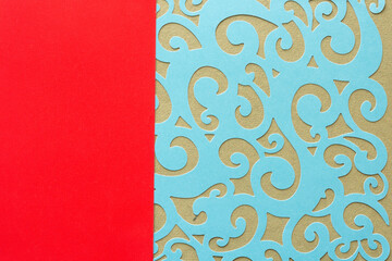 card stock paper background with blue die-cut sheet with fancy shapes