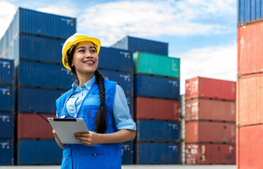 Foreman or worker hand holding tablet or checklist for writing and checking in goods in container at Container cargo site. Occupation, Working, Engineer, Women, Freight Transportation
