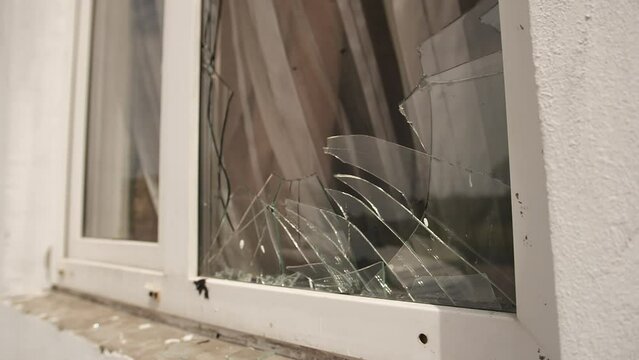 View broken window.Crash glass broken window house destroy building window crack