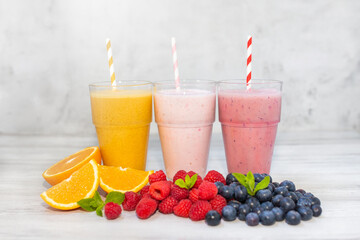 Colorful smoothies, healthy with vitamins, detox, diet. Fruits, berry and vegetables smoothies. Vegan food concept, healthy juicy vitamin drink diet. Fruit milkshakes. 