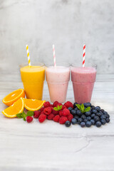 Colorful smoothies, healthy with vitamins, detox, diet. Fruits, berry and vegetables smoothies. Vegan food concept, healthy juicy vitamin drink diet. Fruit milkshakes. 