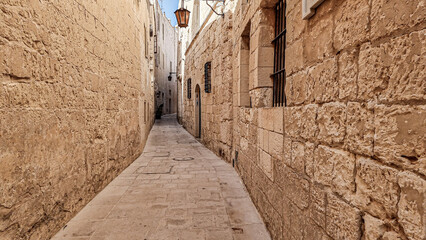 narrow street in old city of Medina, Mdina, Malta
