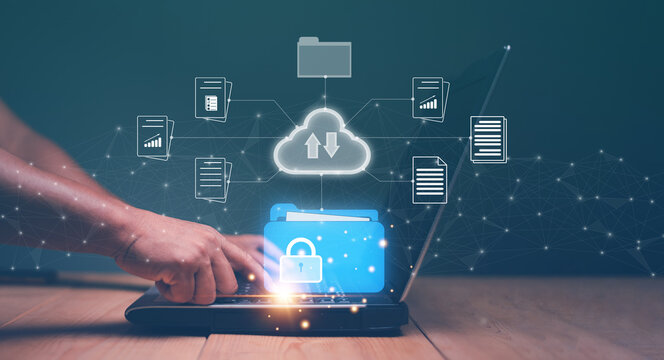 Document management system (DMS) technology concept, Document protection on cloud, Businessman using laptop computer to upload and download data from cloud computing system, Managing corporate files.