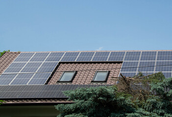 Fototapeta premium Installing a Solar Cell on a Roof.