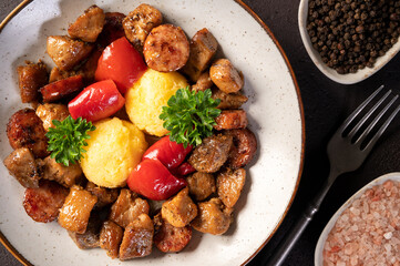 Delicious traditional romanian dish pomana porcului assortment of pork meat and sausages with...