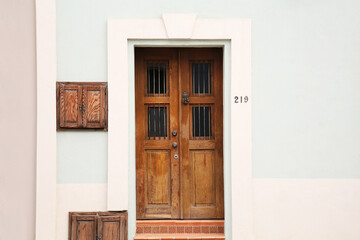Entrance of residential house with wooden door
