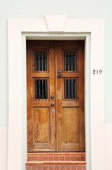Entrance of residential house with wooden door