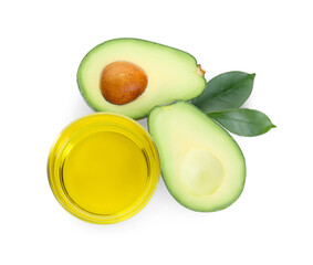 Bowl with oil and cut avocados on white background