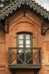 small wooden balcony in a vintage brick