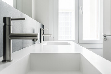 a modern design bathroom, one piece frameless mirror porcelain sinks