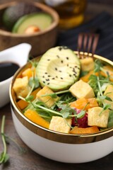 Delicious salad with tofu and vegetables on table, closeup