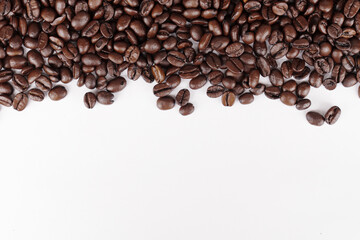 Roasted coffee beans on white background