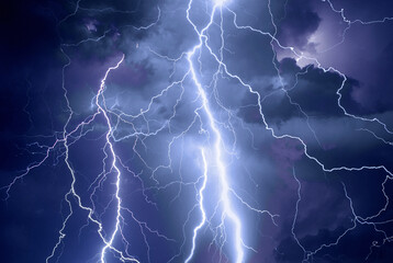 Fork lightning striking down during summer storm	