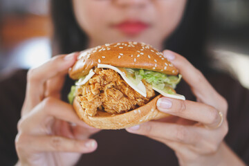 hand holding a hamburger