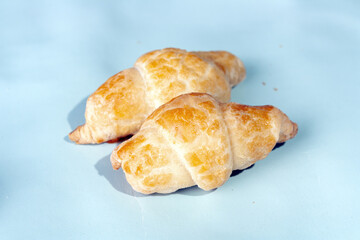 ruddy breakfast buns on a blue background, copy space