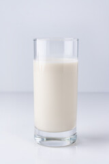 vegetable milk in a glass on a white background, healthy food